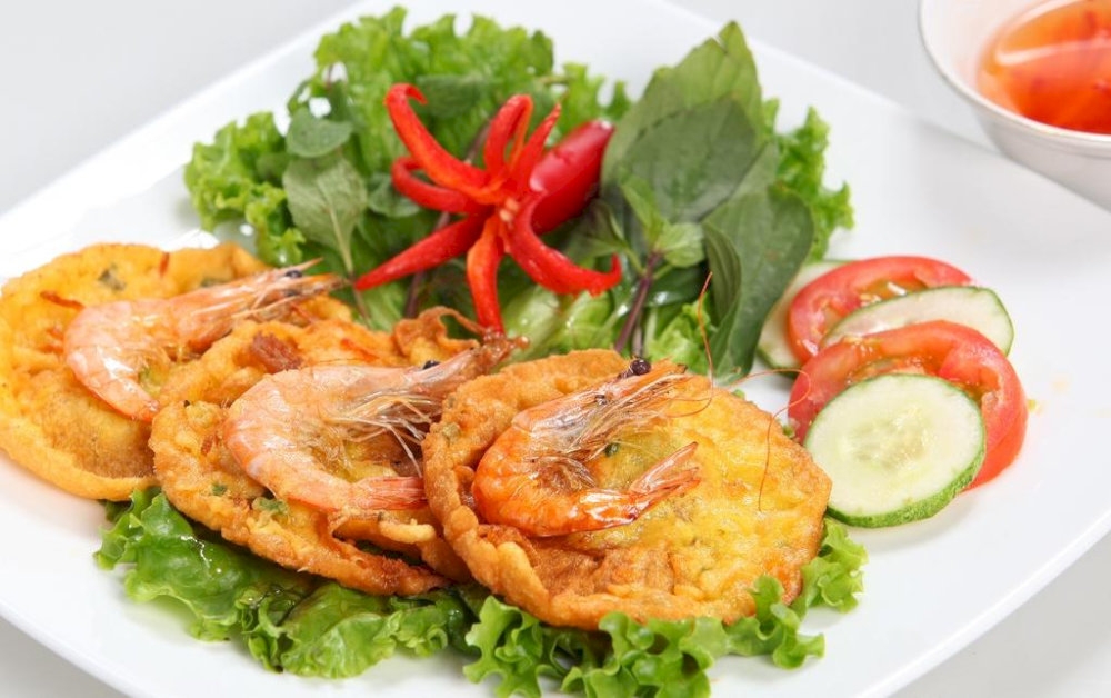 Enjoy the crispy goodness of Banh Tom Ho Tay